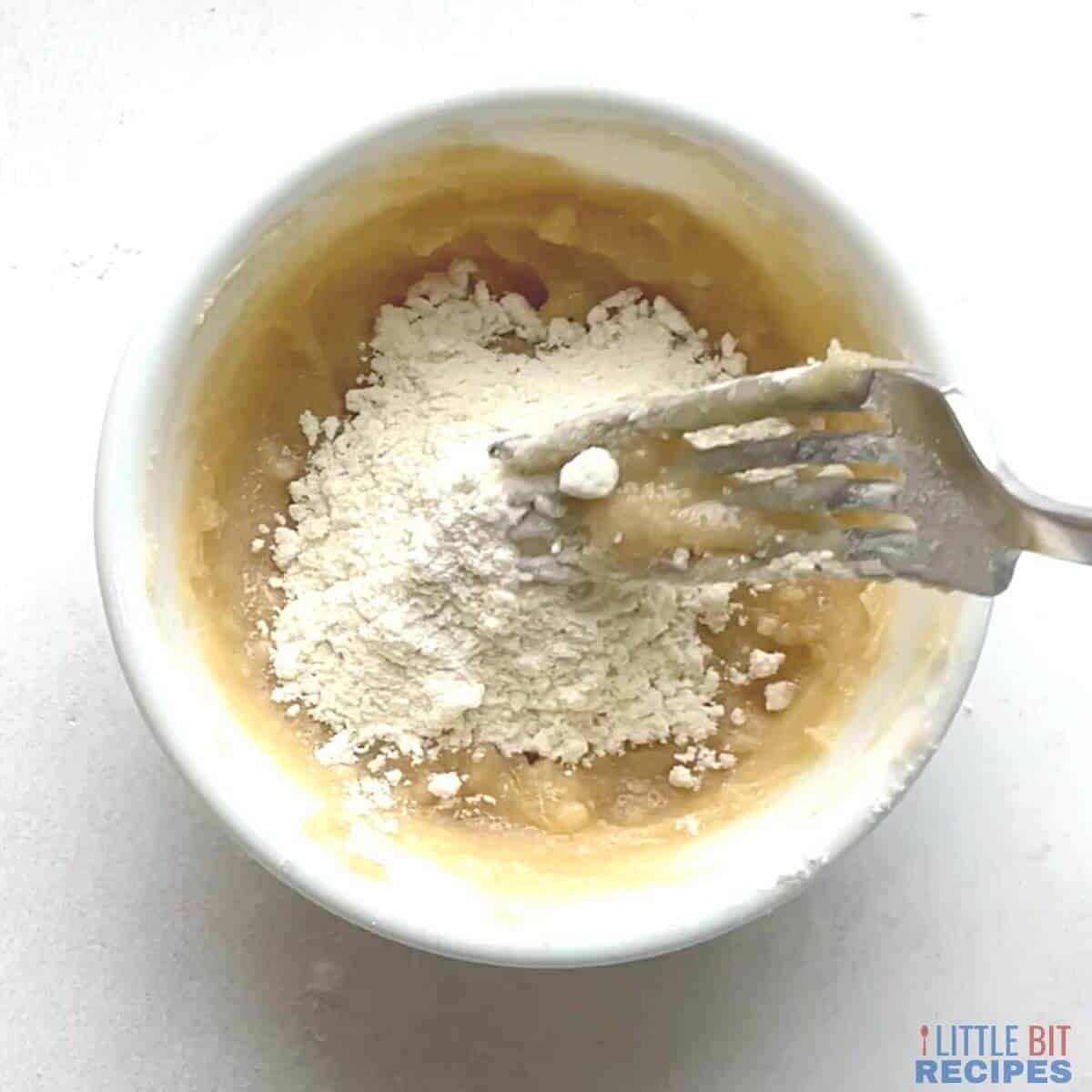 flour added to butter mixture in small white bowl.