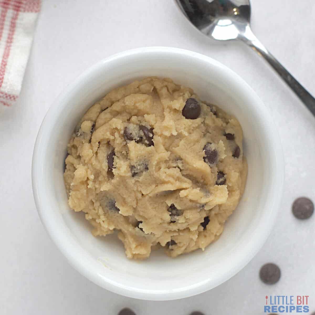 edible cookie dough in small white bowl.