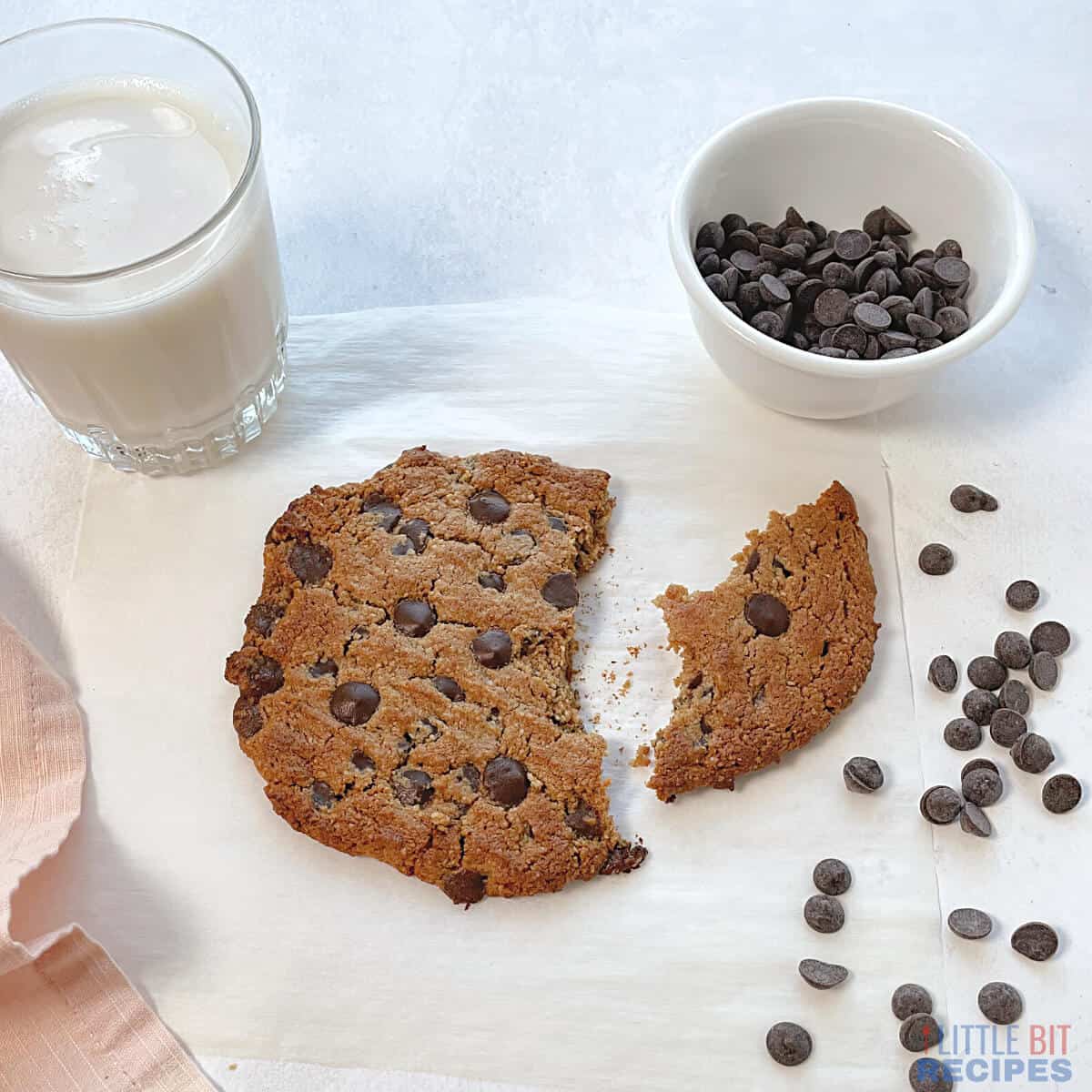 broken cookie with almond milk and chocolate chips.