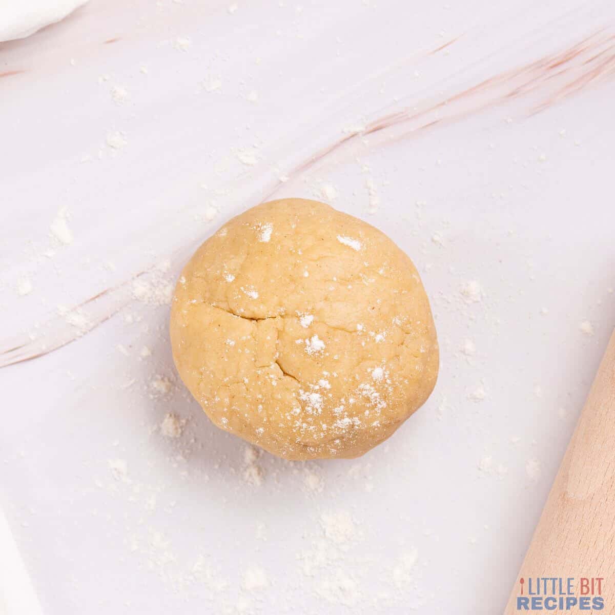 dough ball on floured surface.