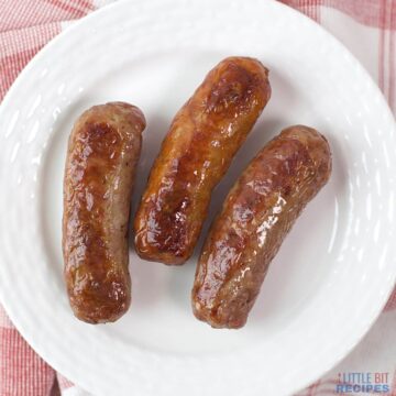 baked italian sausage links on white plate.