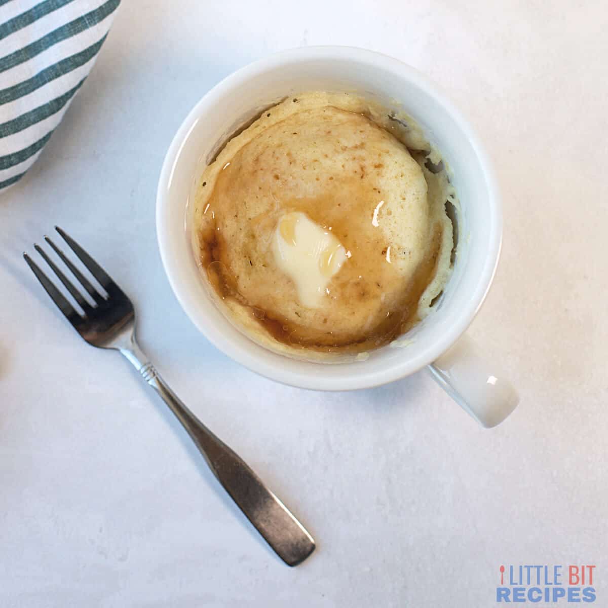 pancake in a mug with butter and syrup square image.