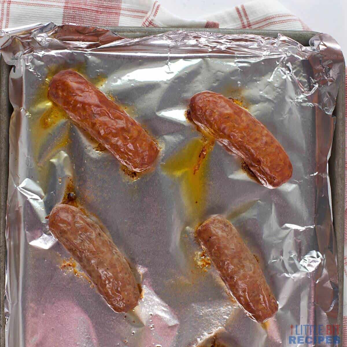 sausage cooked in oven on foil.
