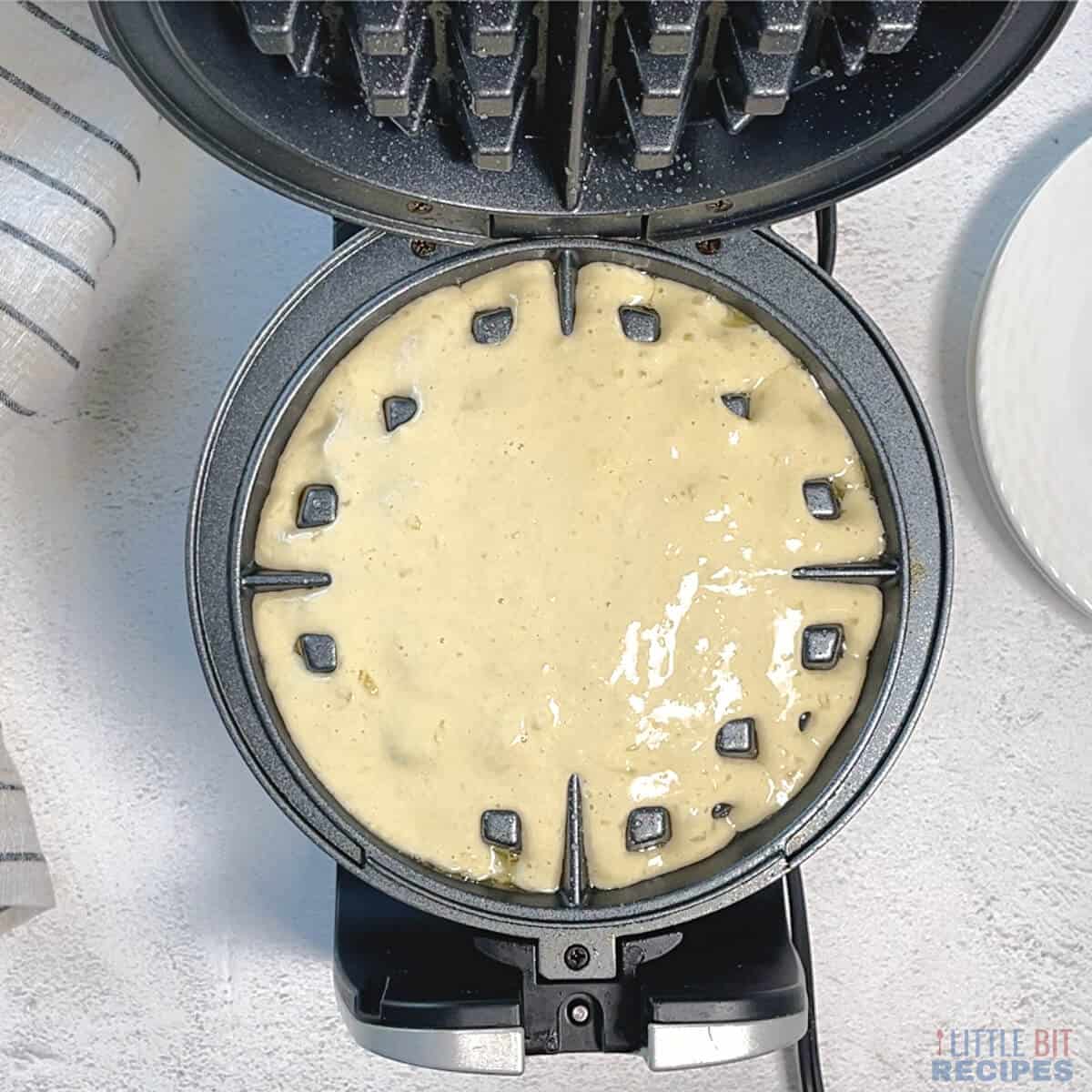 batter in waffle iron.