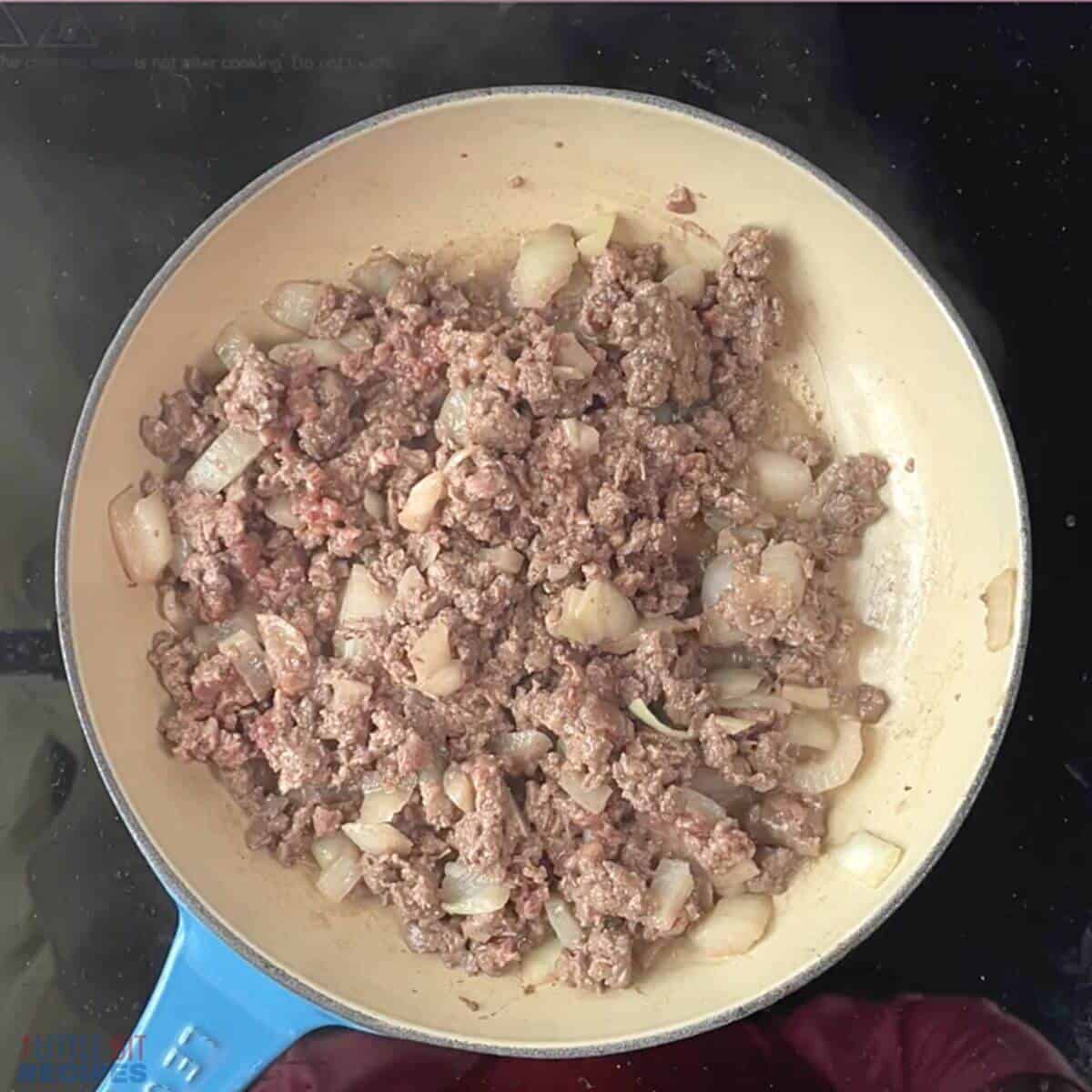 browned ground meat in skillet.