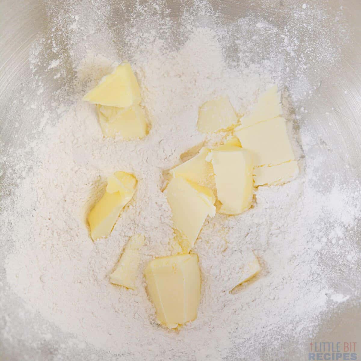 butter and flour in metal mixing bowl.