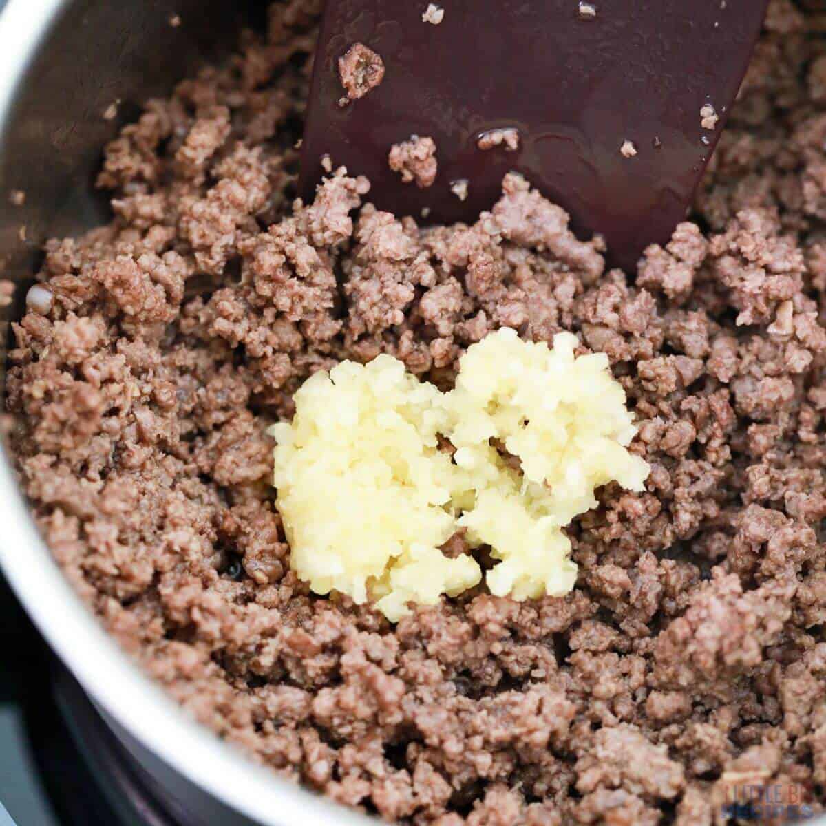 minced garlic added to browned ground beef.
