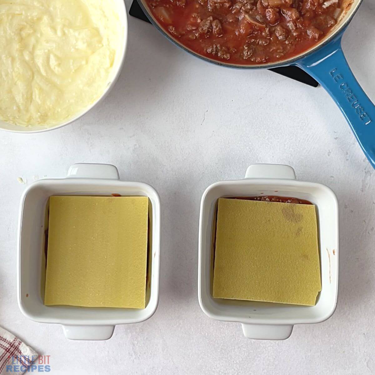 noodle layer in baking dishes.