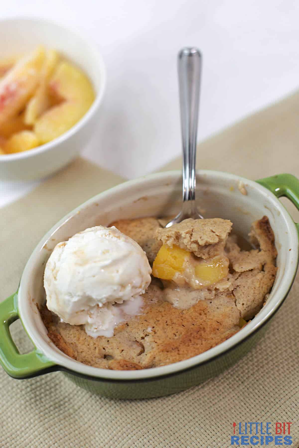 serving cobbler with ice cream on top.