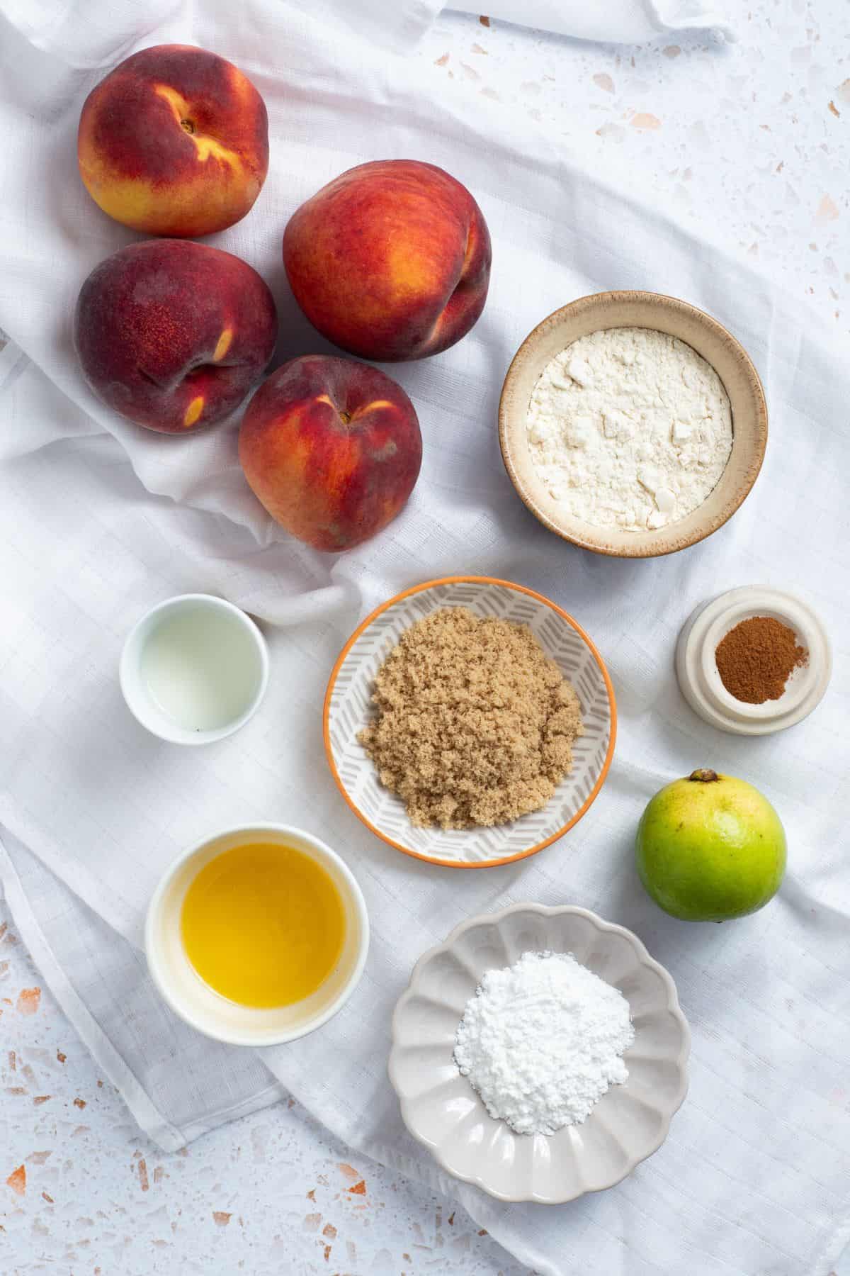 Peach cobbler recipe ingredients on white background.