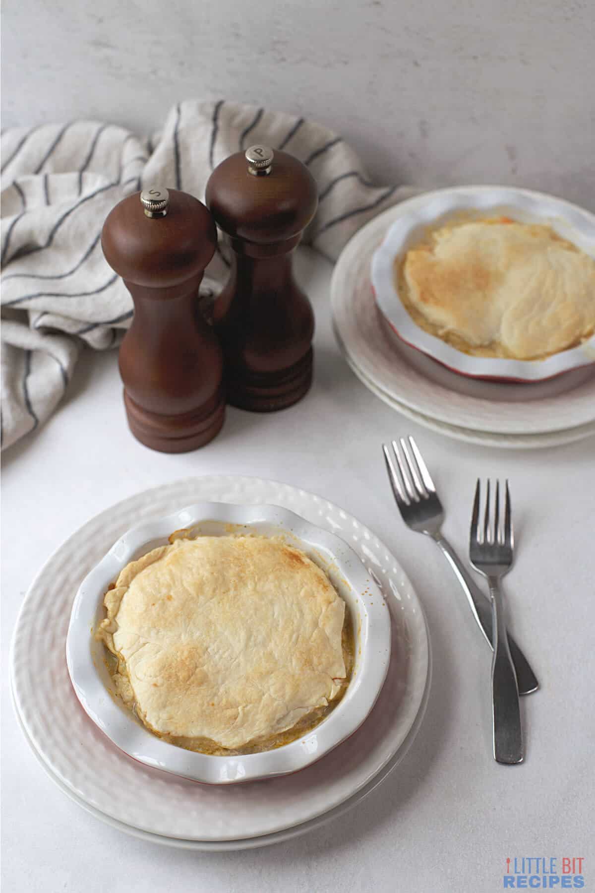 serving pot pies on plates.