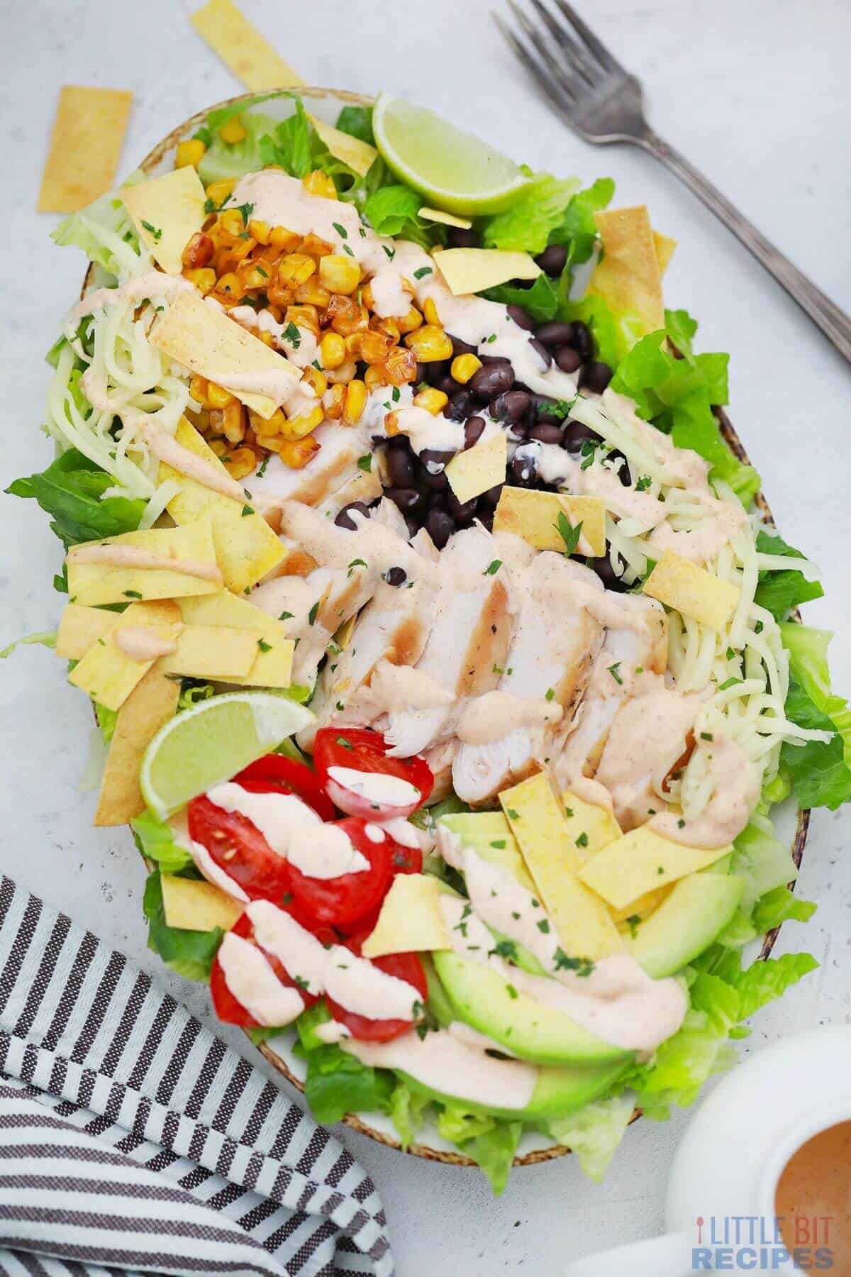 santa fe salad with fork and striped napkin.