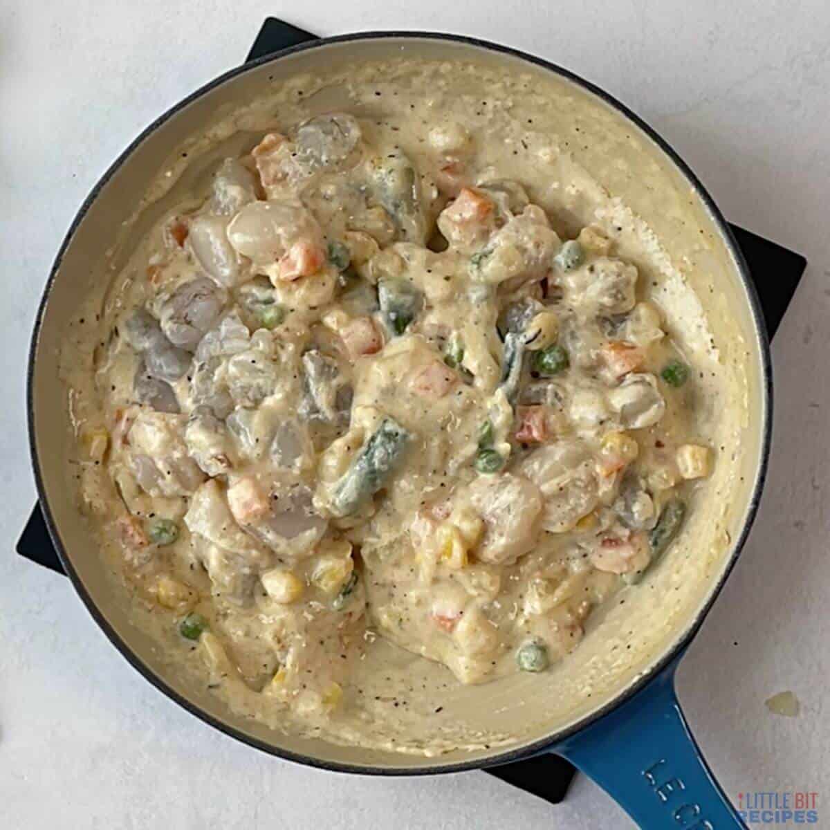 seafood added to skillet.