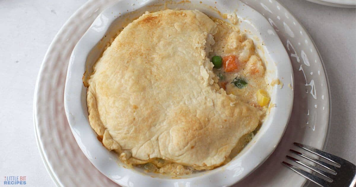 seafood pot pie in dish with fork.