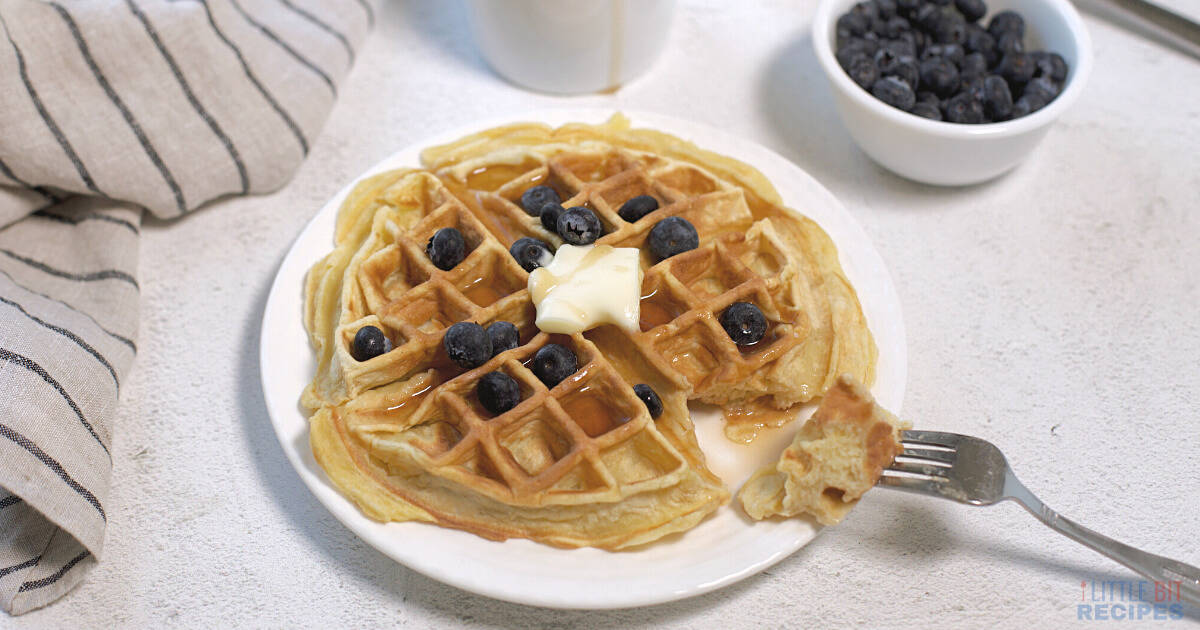 Belgium waffle for one with butter and blueberries.