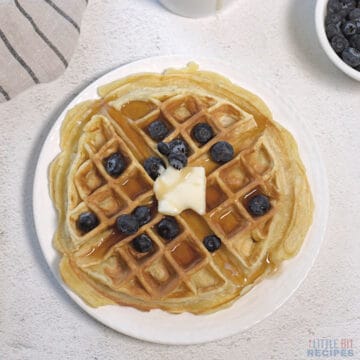 single serve waffle with butter and blueberries.