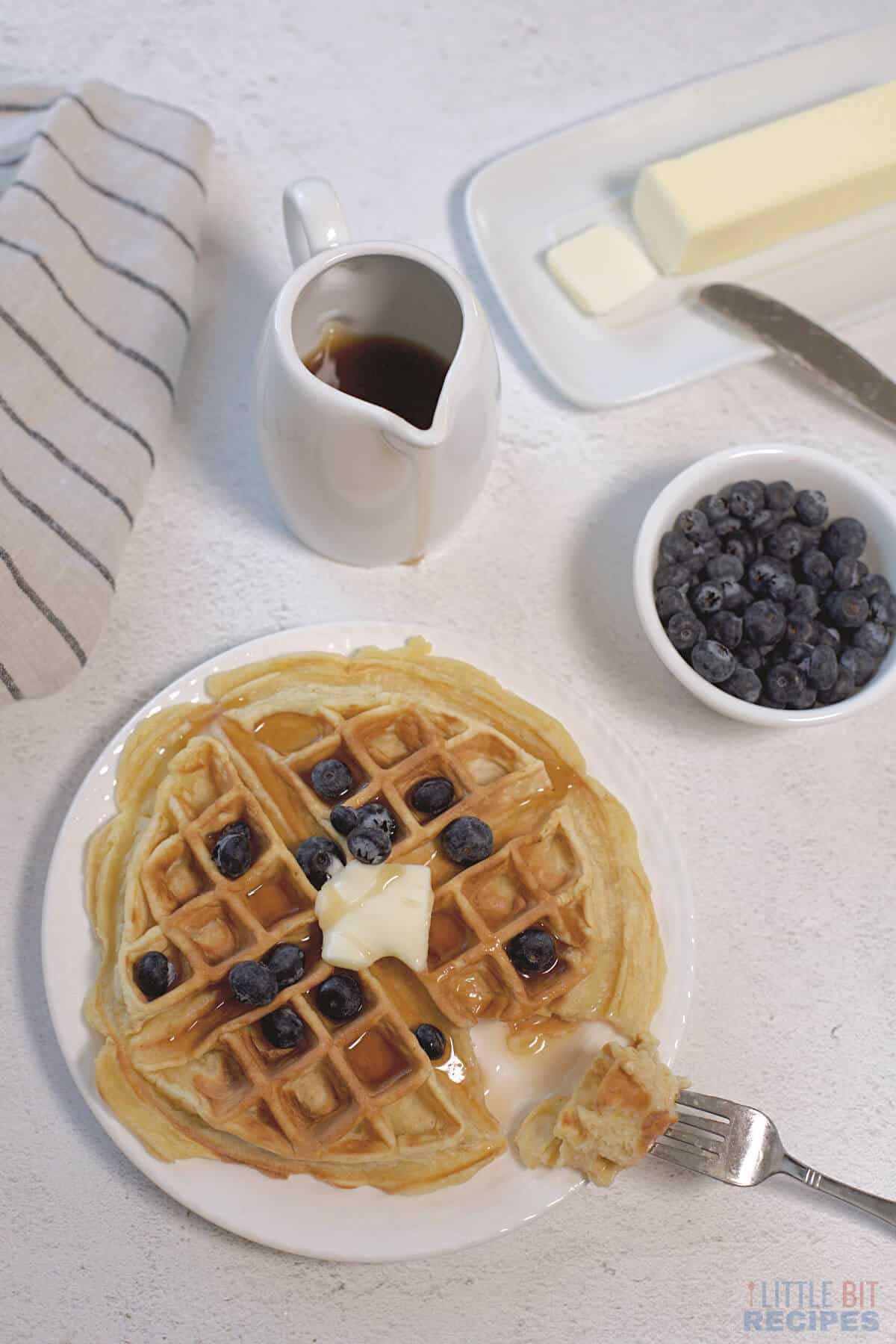 single serving waffle with fork bite.