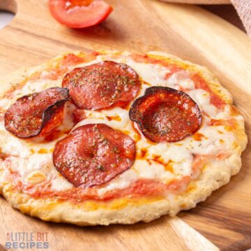 small batch pizza dough pizza on board.