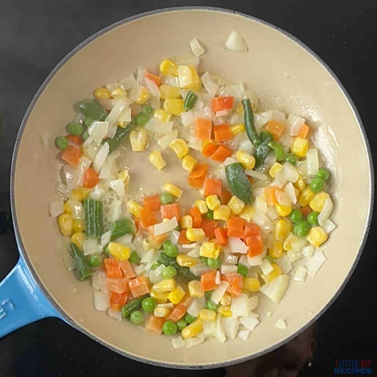 tender cooked vegetables in skillet.