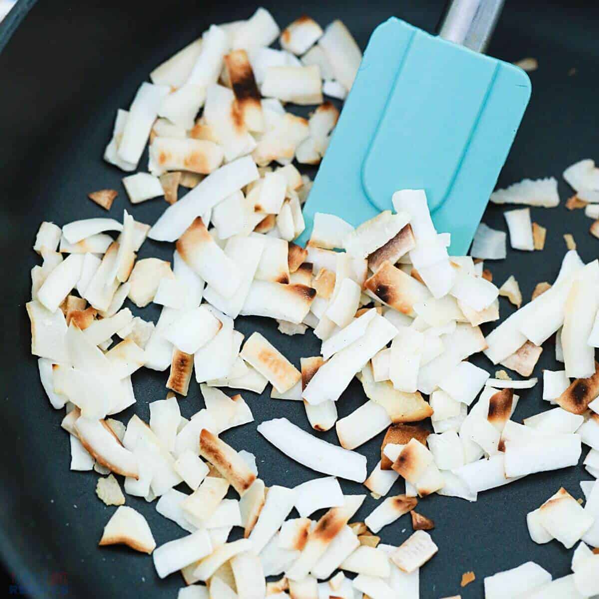 toasting coconut in pan.