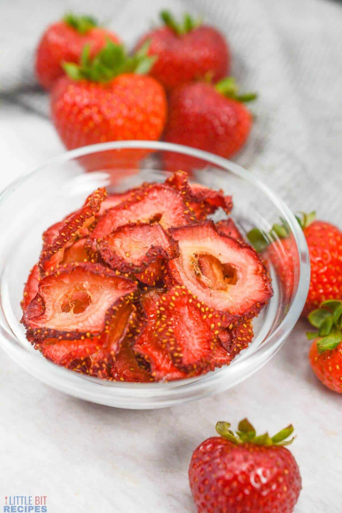 air fried strawberry slices in bowl with berries.