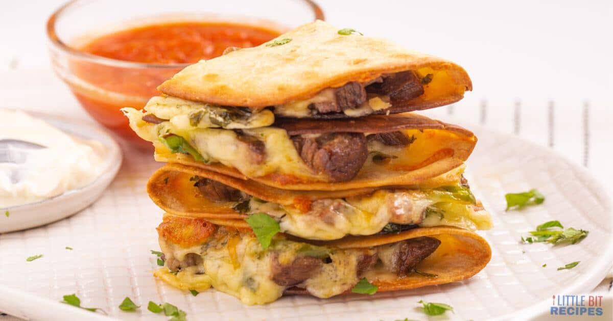 Stack of beef quesadillas on a plate.