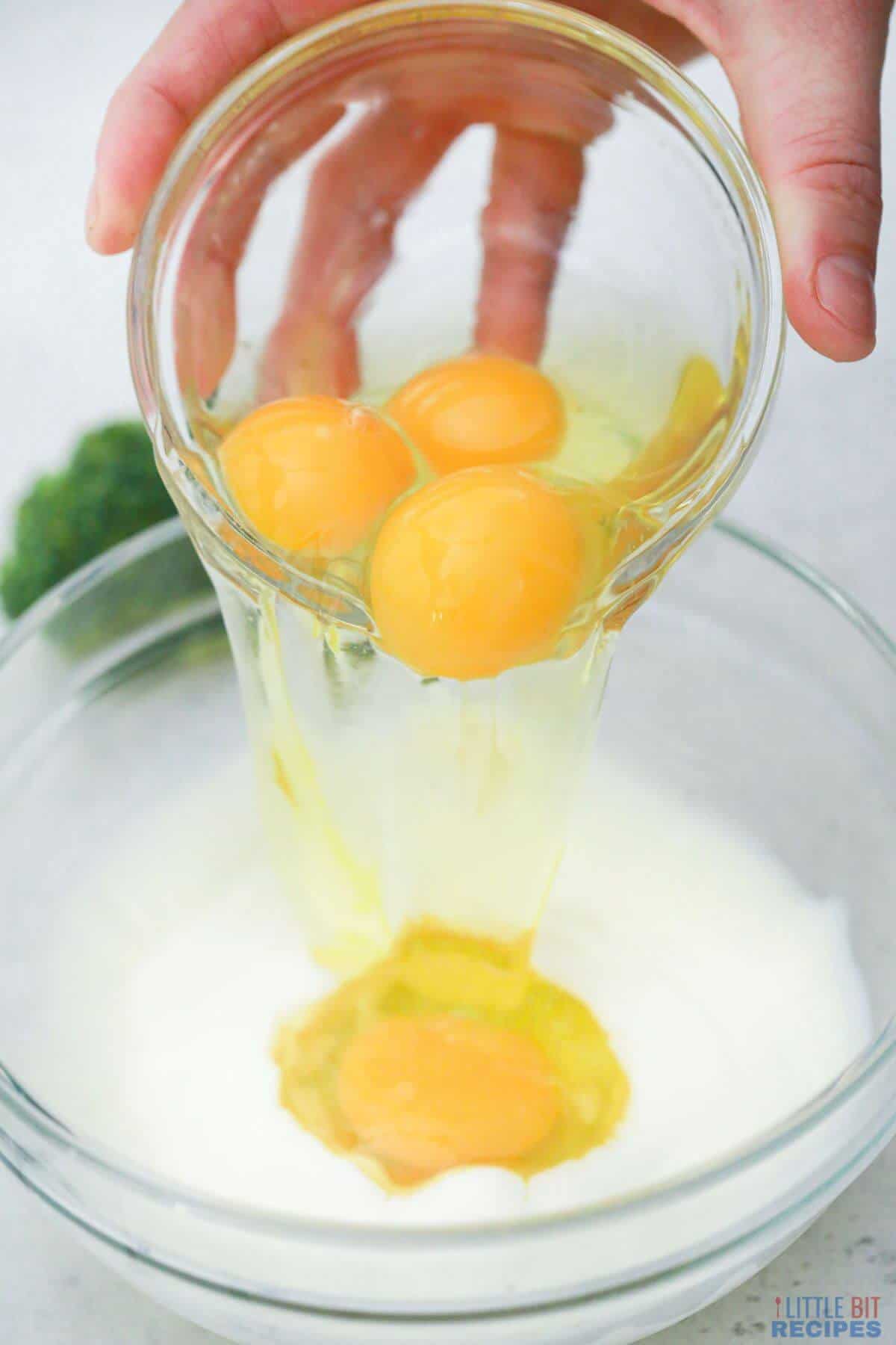 adding eggs to milk in bowl.
