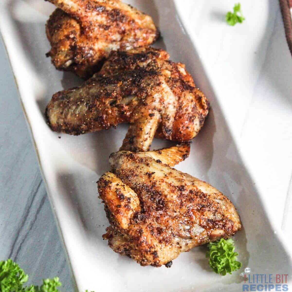 air fried chicken wings on platter.