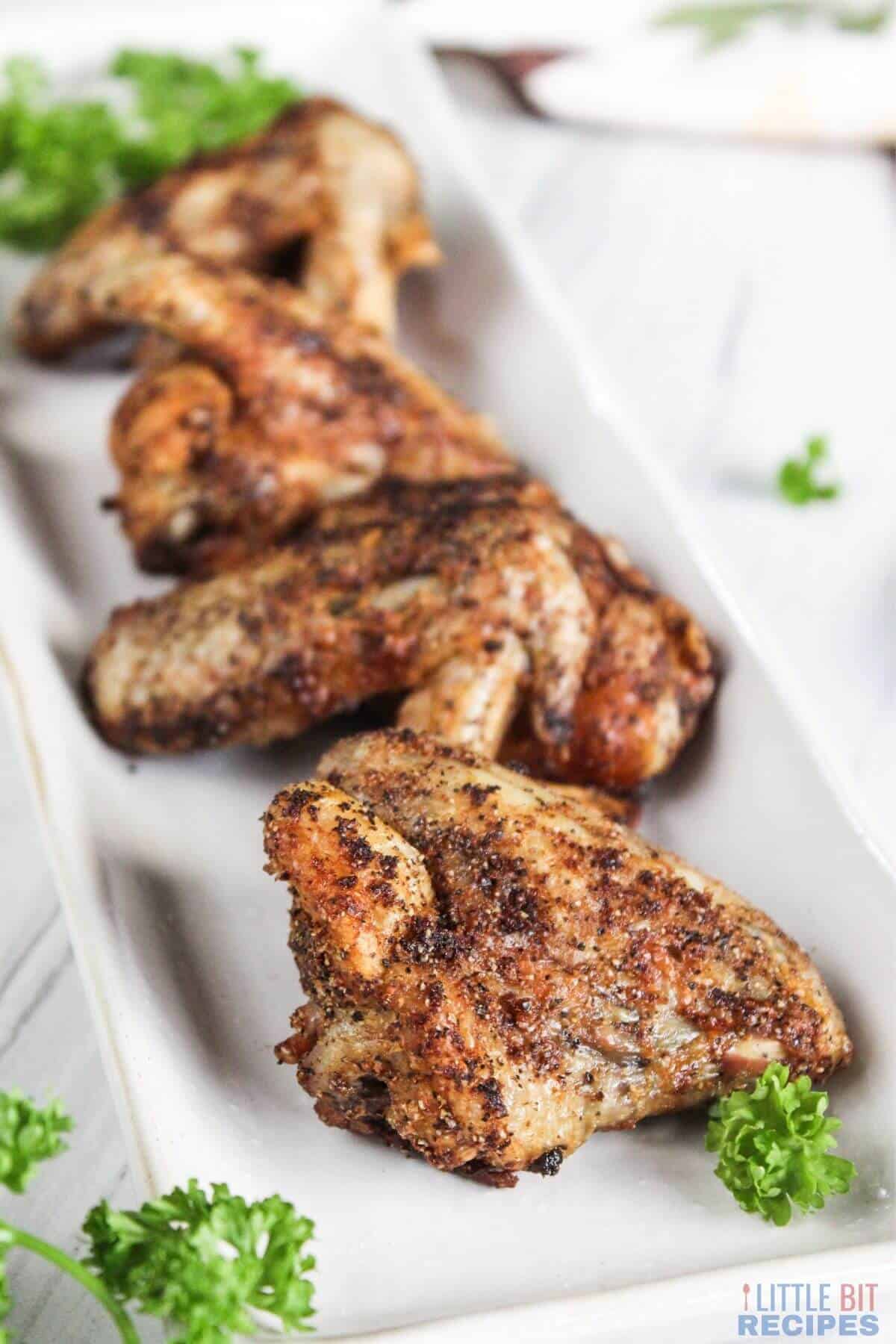 air fried chicken wings on platter.
