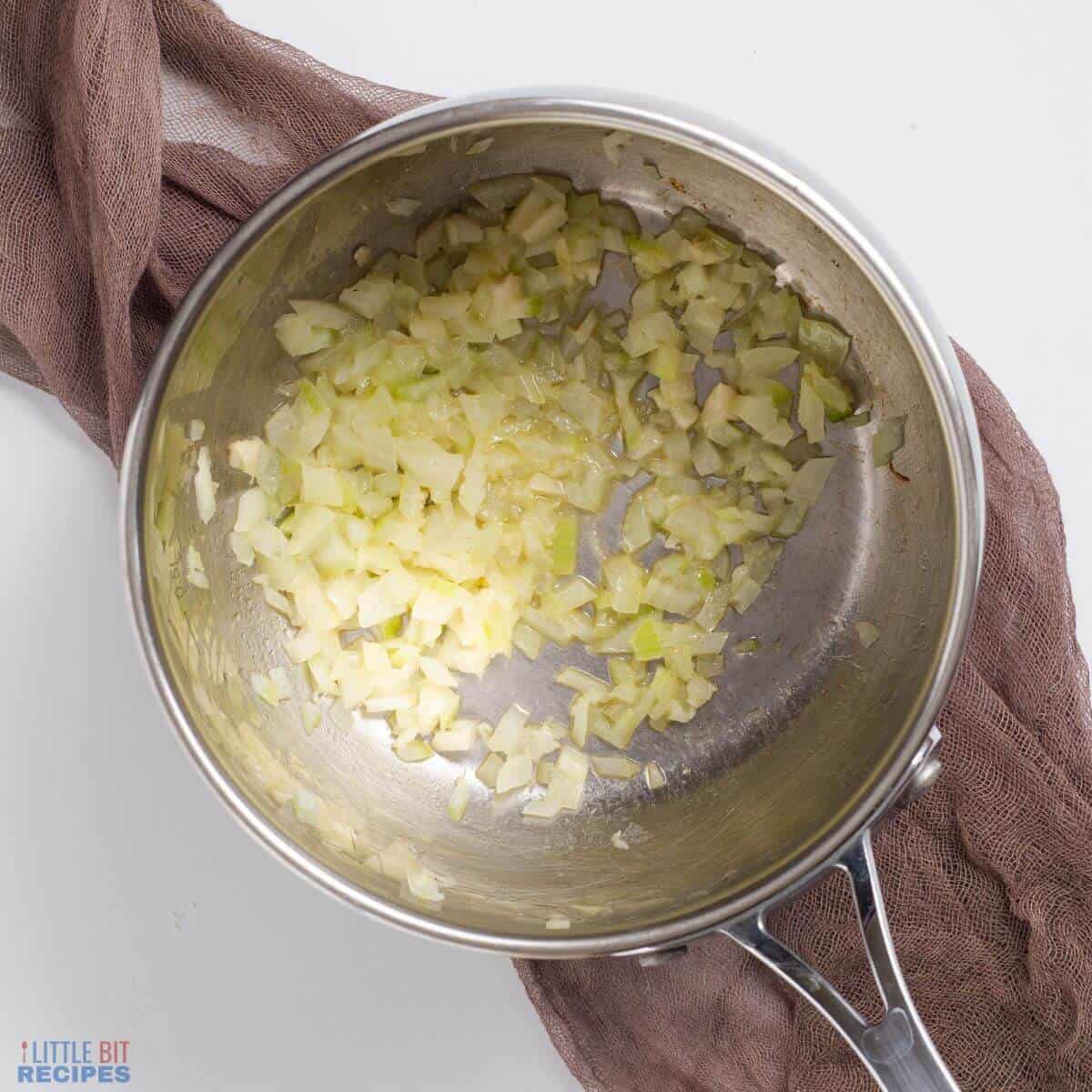 butter garlic onions in saucepan.