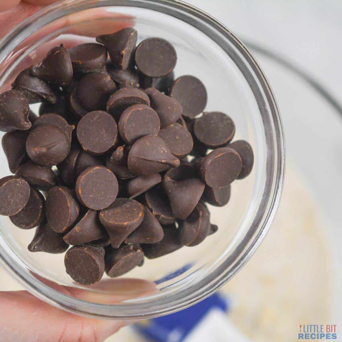 adding chocolate chips to bowl.