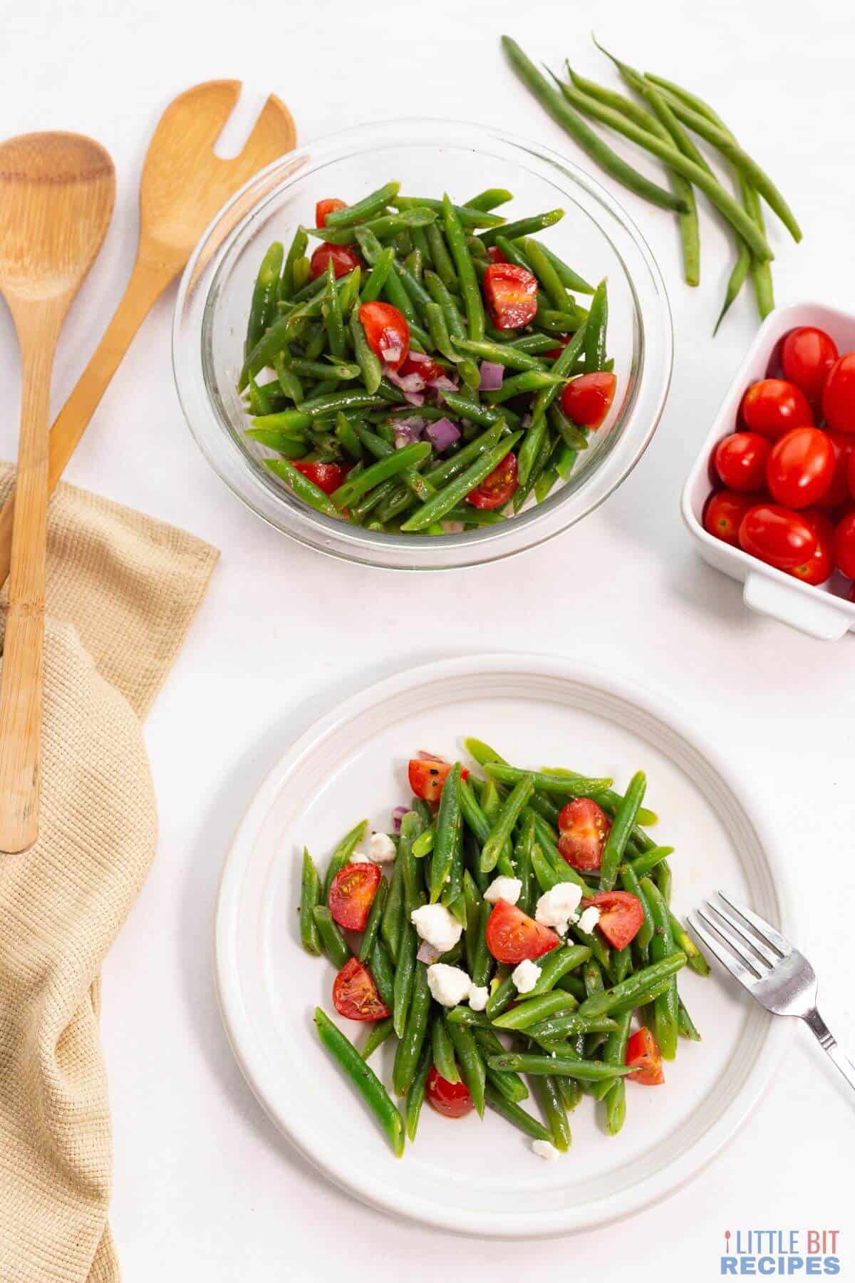 serving green bean salad on white plate.