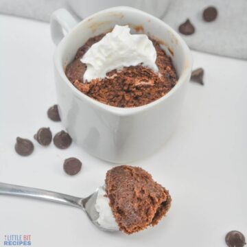 nutella mug cake with spoon bite out.