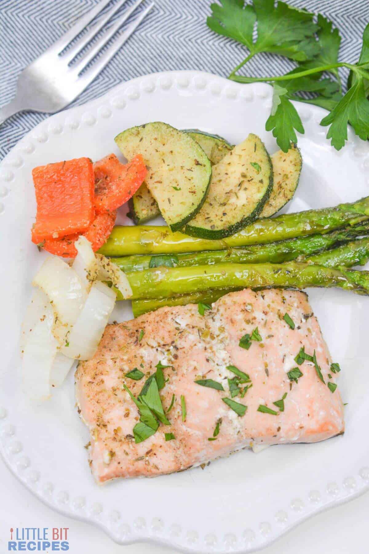 salmon and vegetables on plate.