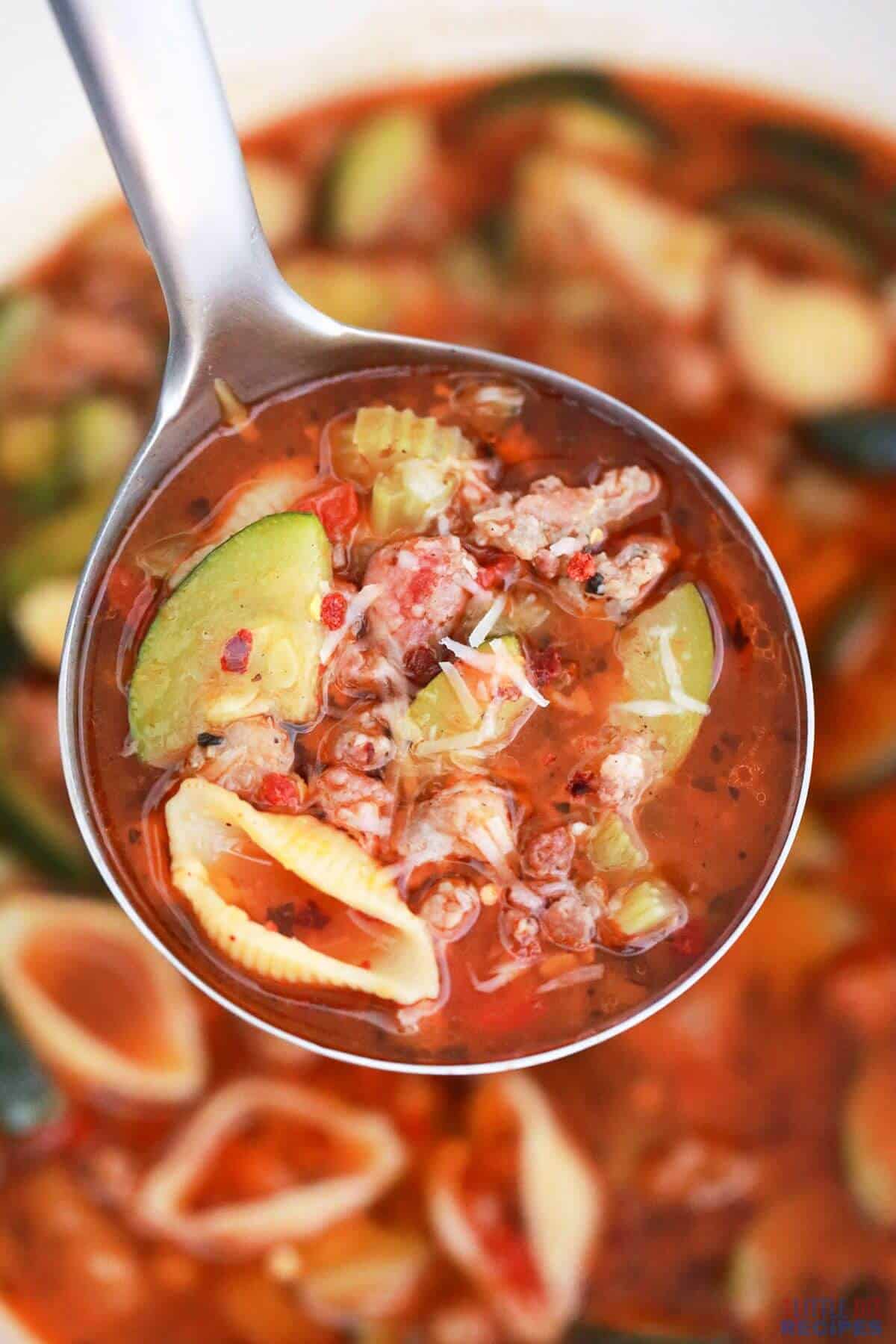 soup in ladle over pot.