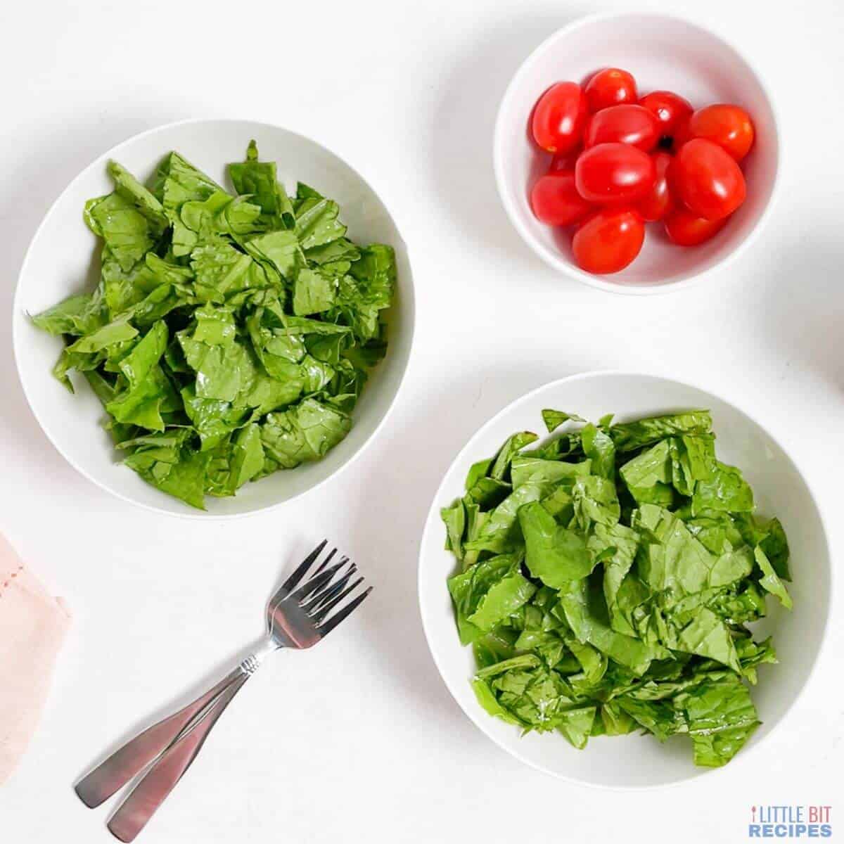 chopped romaine lettuce in two serving bowls.