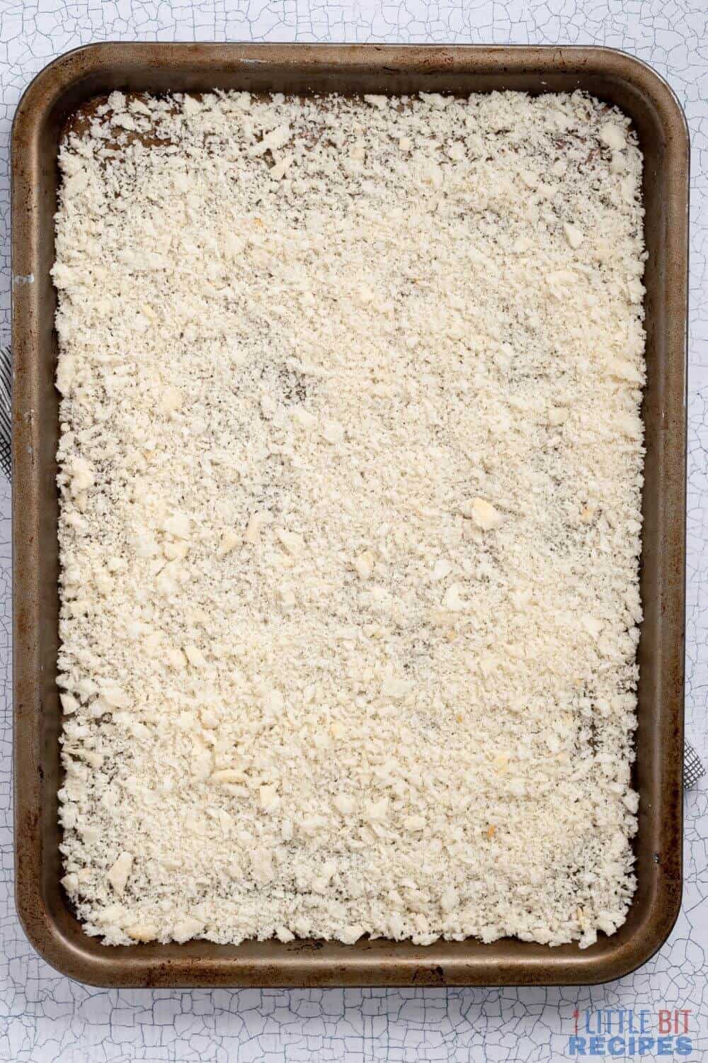 bread crumbs on baking sheet.