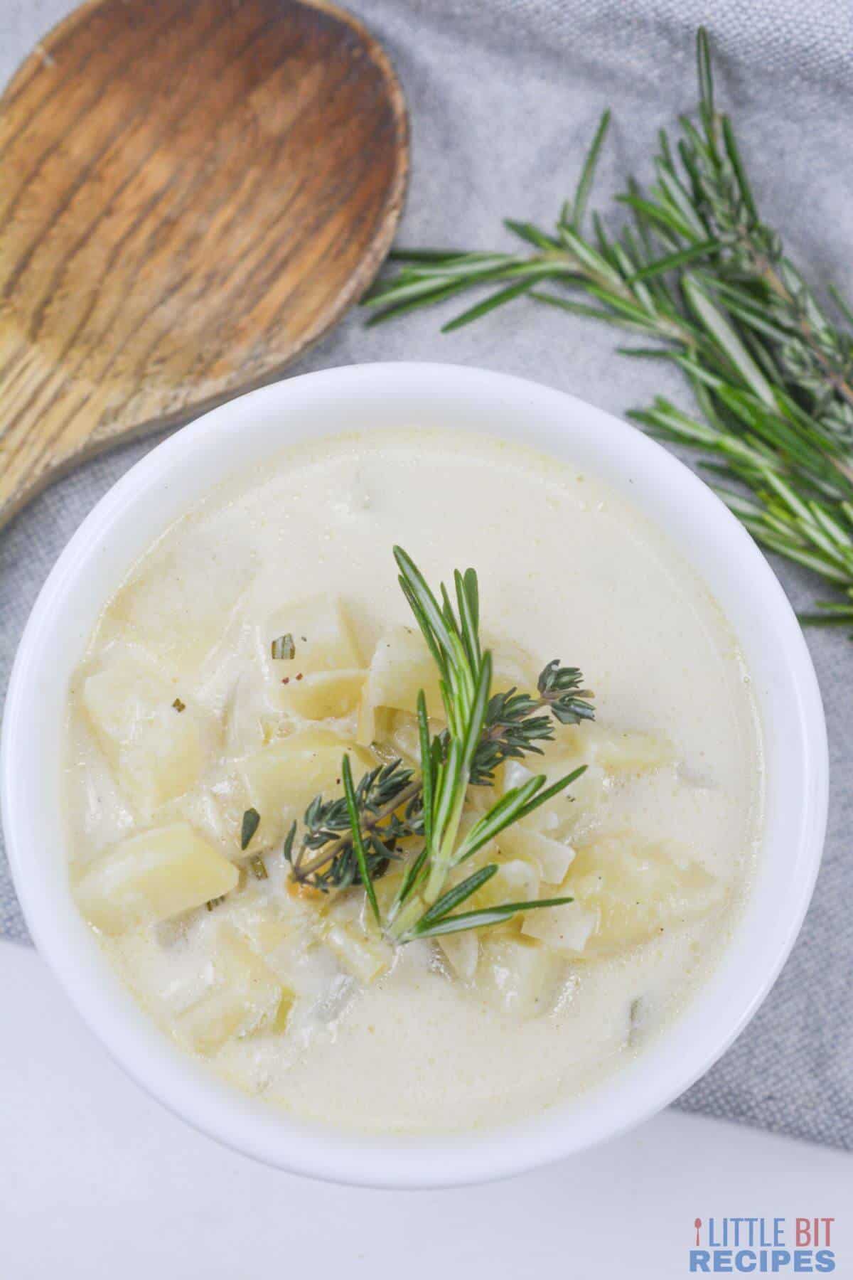 vegetarian potato soup in white serving bowl.