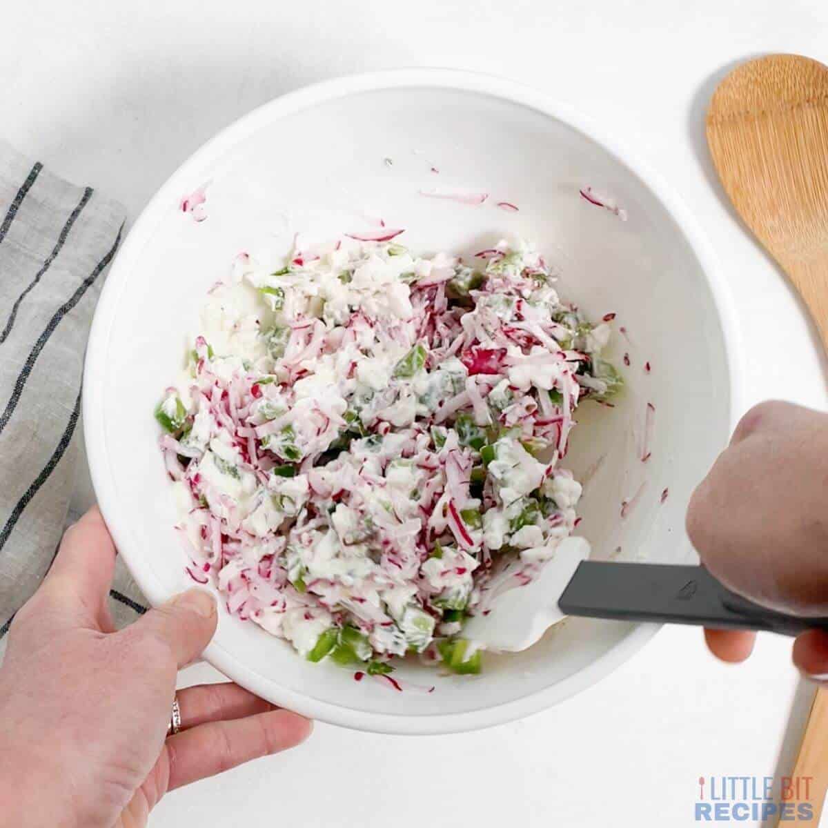 combining all ingredients in mixing bowl.