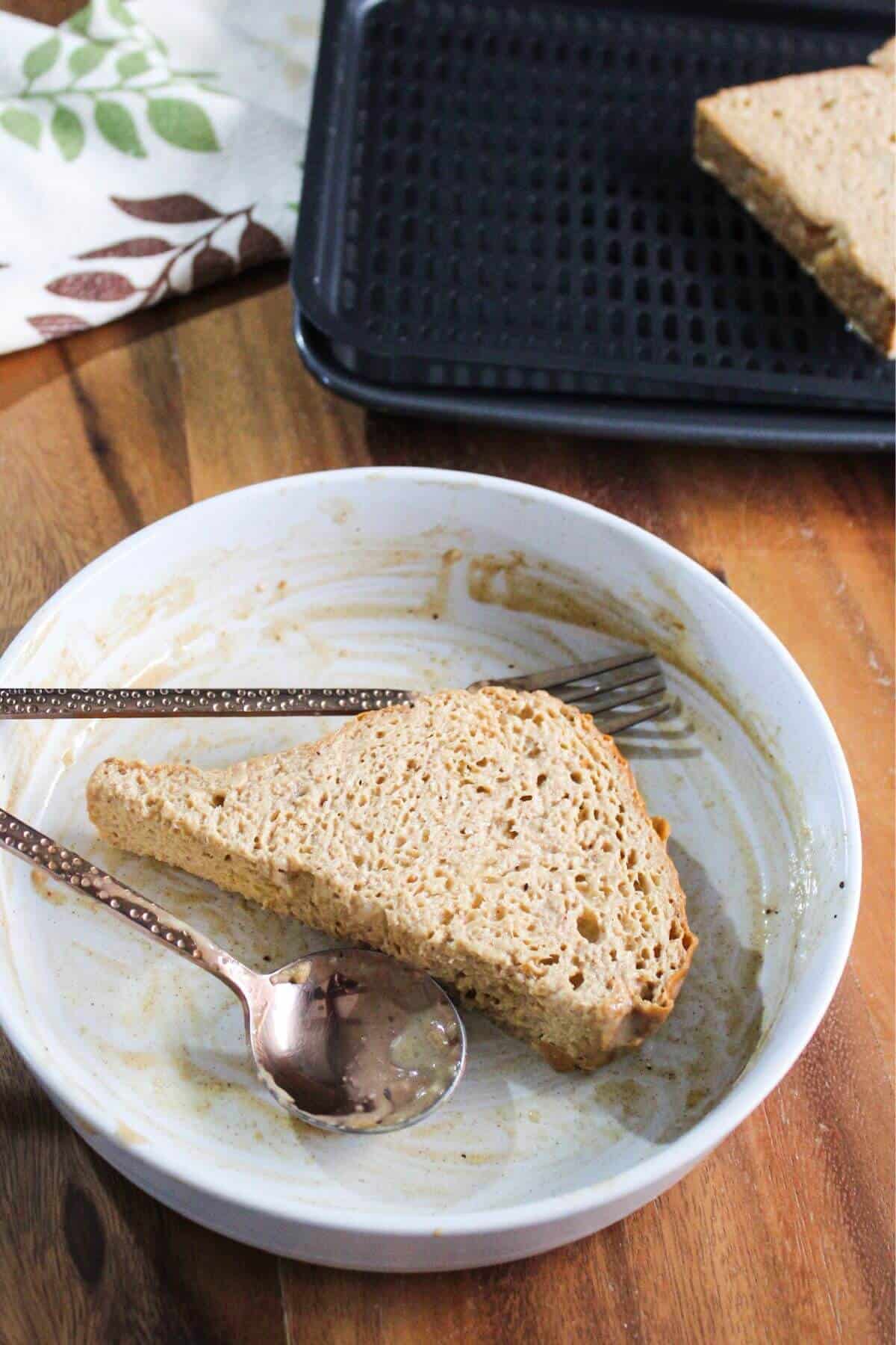 Half bread slice soaked in egg mixture.