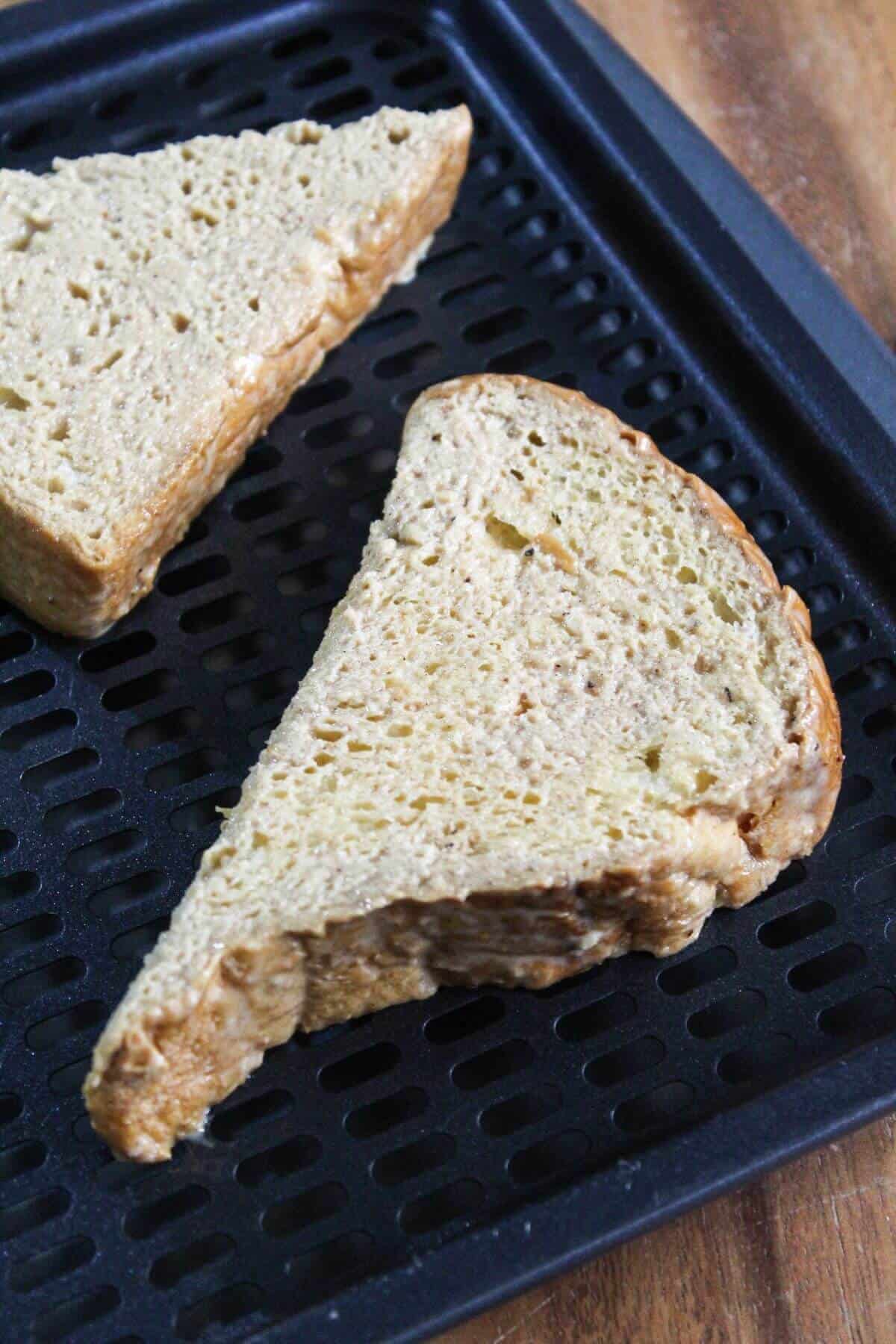 Egg mixture soaked bread on air fryer tray.