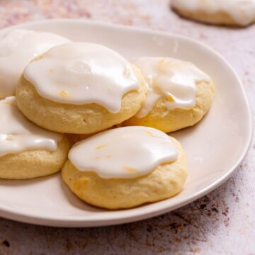 Lemon ricotta cookies on small plate.