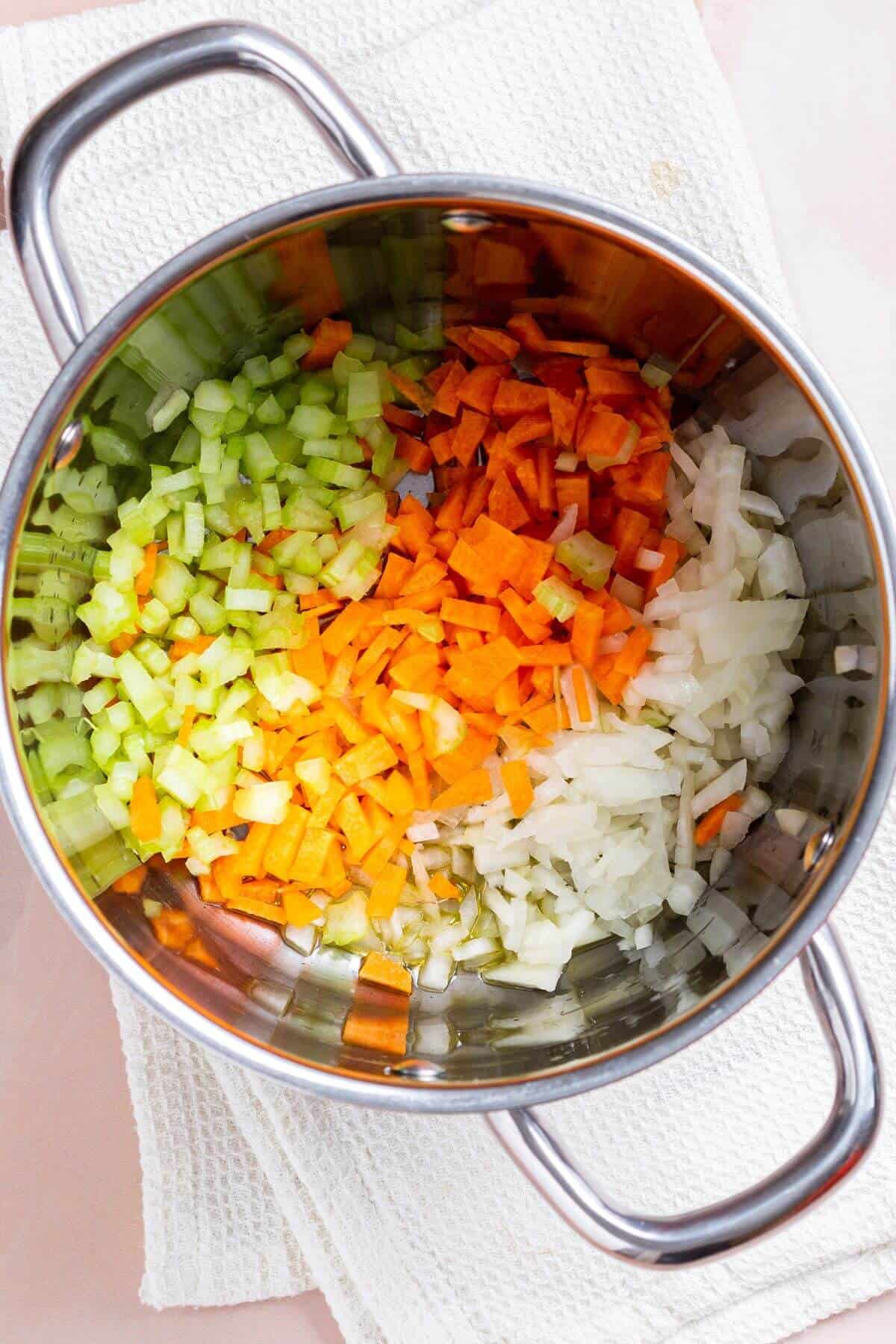 Vegetables in soup pot.