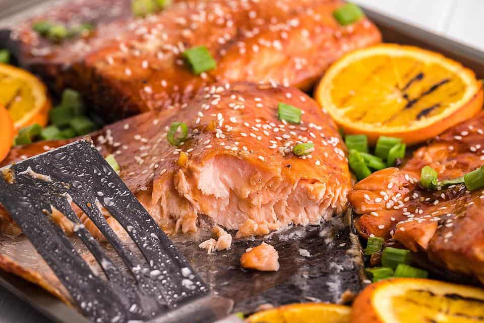 Orange BBQ salmon with foil packet vegetables.
