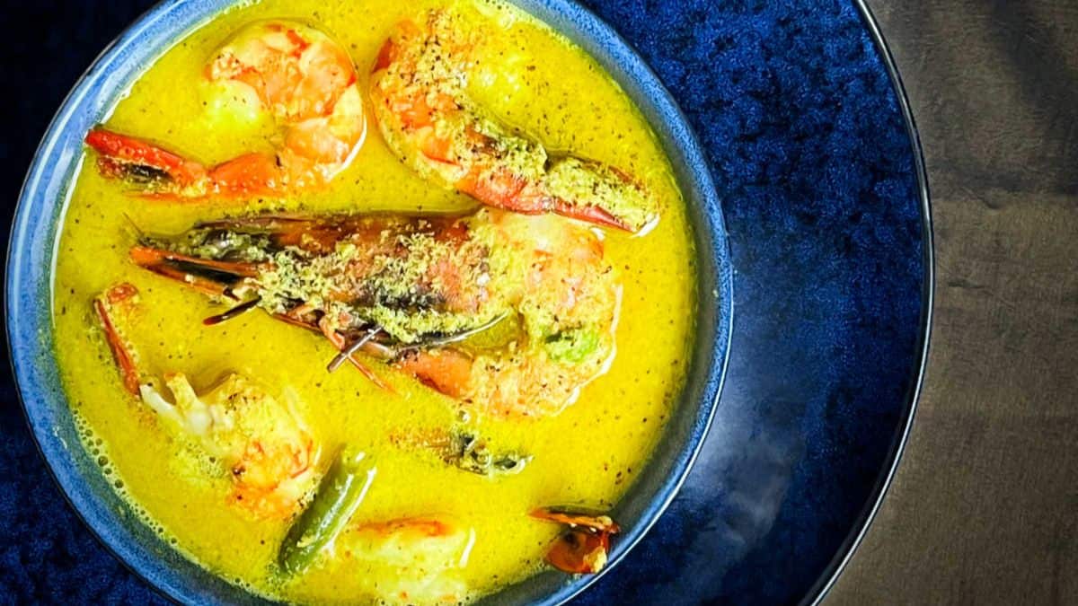 Shrimp coconut curry in blue bowl.
