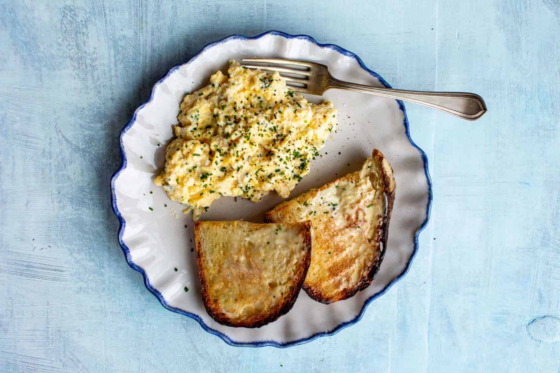 Soft scrambled egg with ricotta cheese.