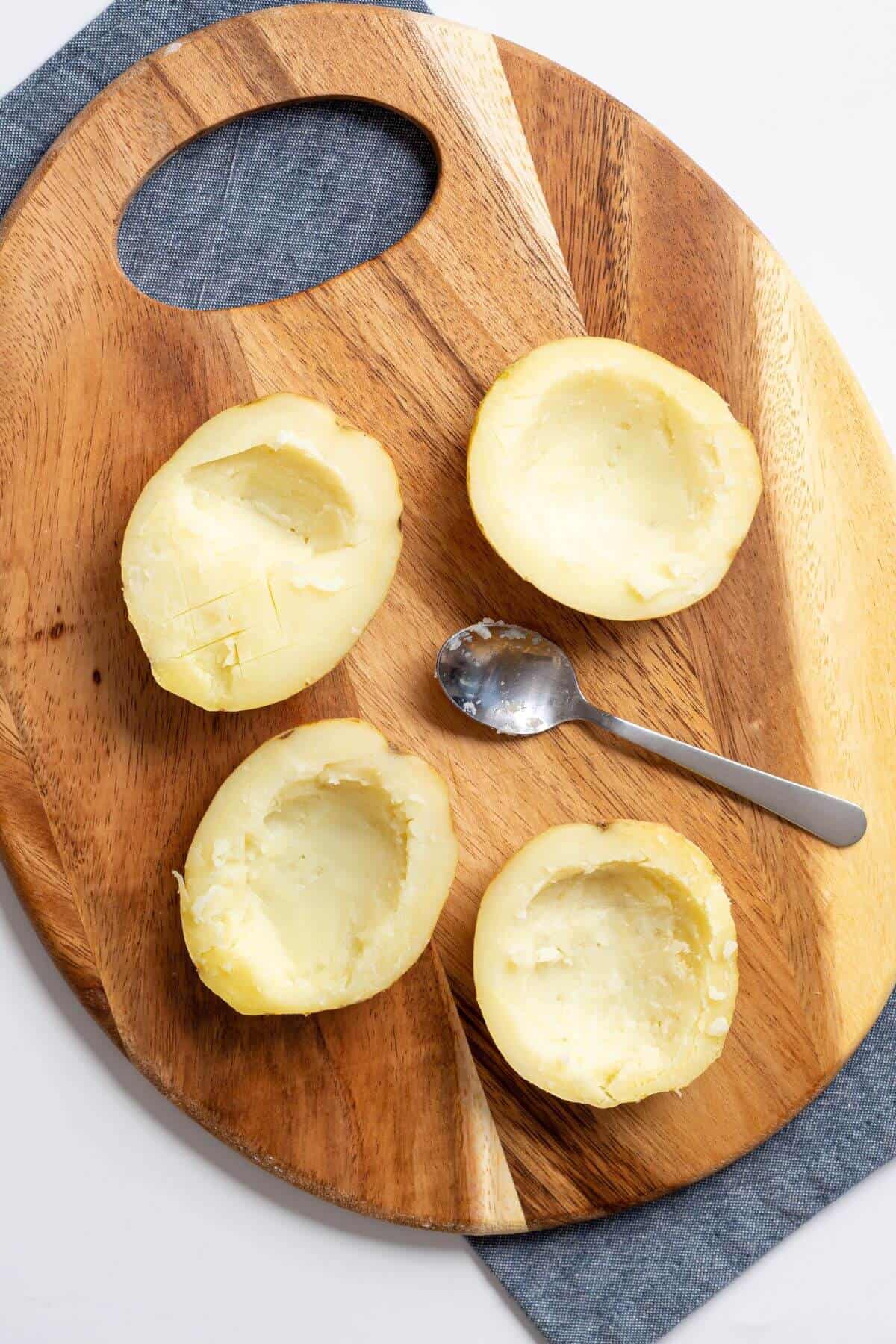Potatoes with inside scooped out.