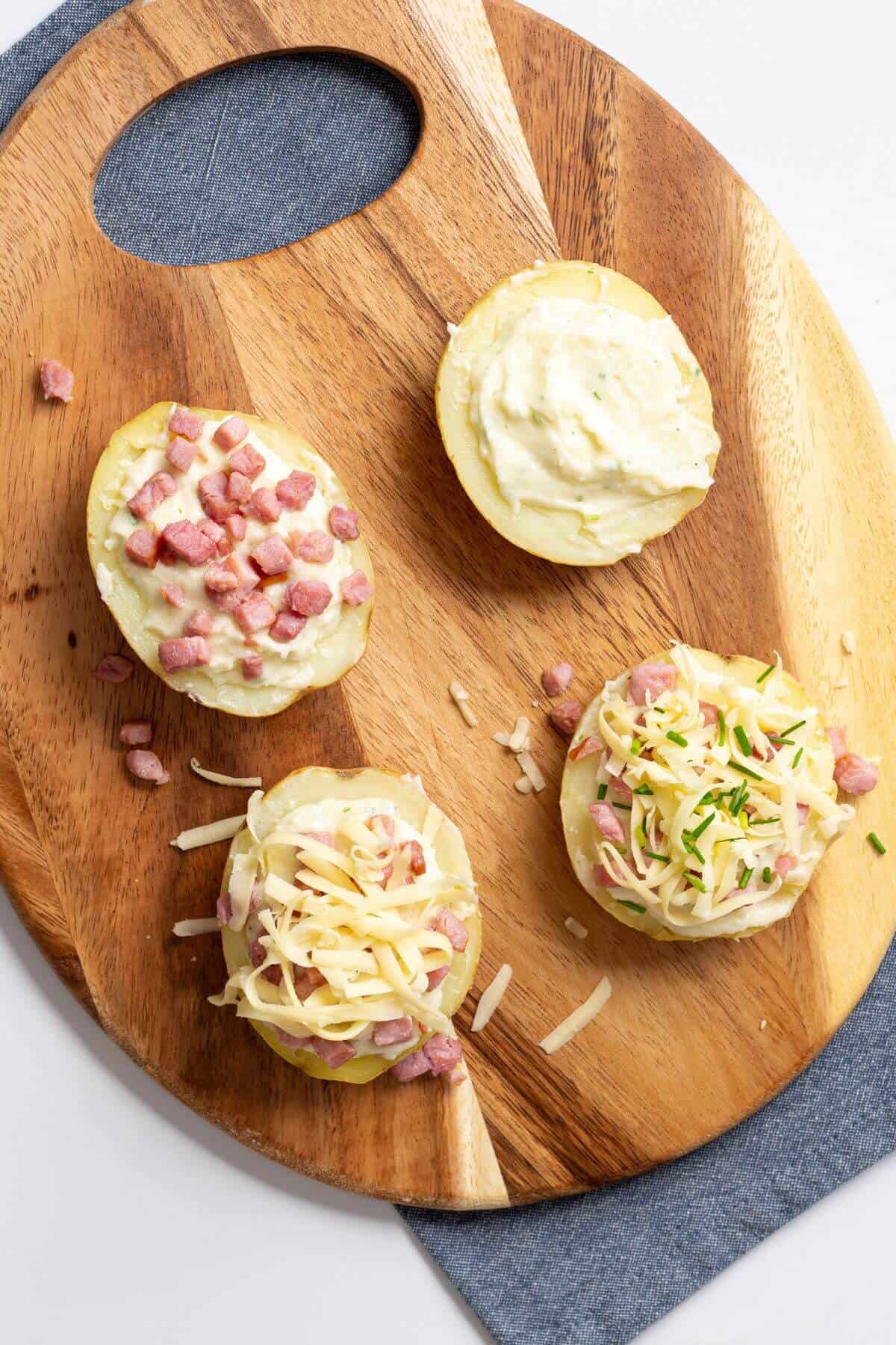 Potatoes with filling and toppings.