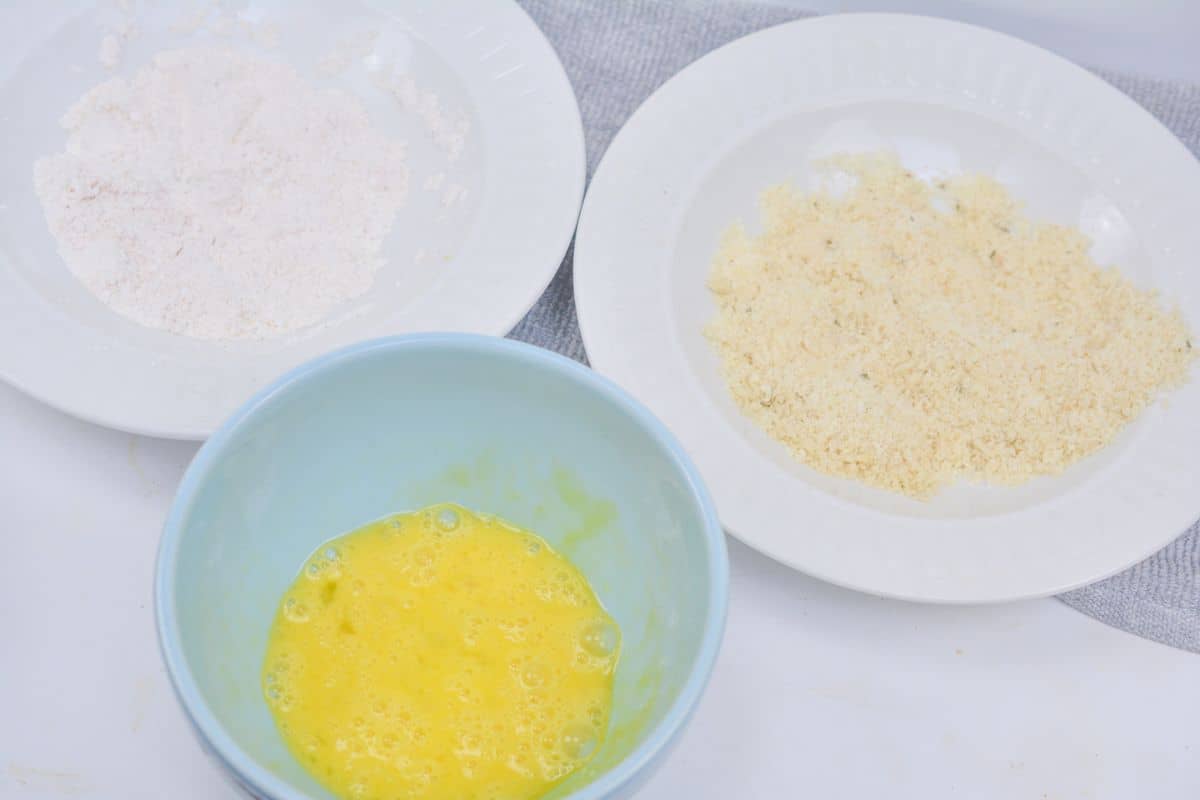 Prepped bowls with egg, flour, and breading.