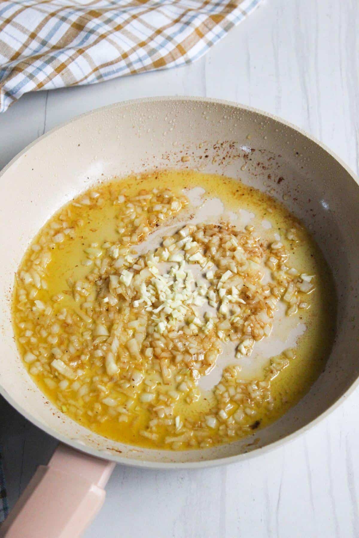 Cooked onions in skillet.